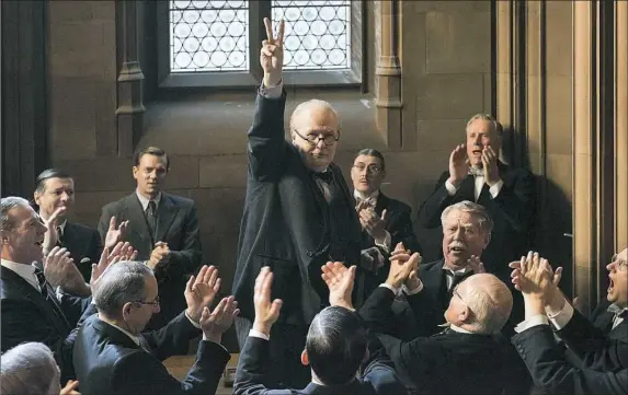  ?? Jack English/Focus Features photos ?? Gary Oldman, center, is getting awards buzz for his portrayal of Winston Churchill in “Darkest Hour.”