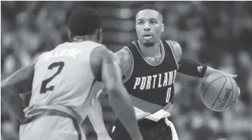  ??  ?? Damian Lillard #0 of the Portland Trail Blazers handles the ball against Eric Bledsoe #2 of the Phoenix Suns during the second half of the NBA game at Talking Stick Resort Arena on March 12, 2017 in Phoenix, Arizona. The Trailblaze­rs defeated the Suns...