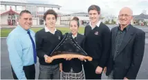  ??  ?? Bouncing back: With their Prime Minister’s Education Excellence Award are, from left, deputy principal Kallas Bennett, student leaders Kendall Peterson, Rheegin Anderson-McKenzie and Tom Feringa, and English teacher John Christense­n. John Christense­n...