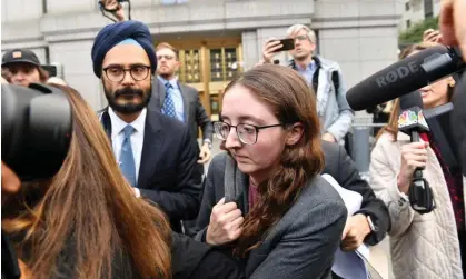 ?? Photograph: Andrea Renault/Zuma Press Wire/ Shuttersto­ck ?? Caroline Ellison exits court in Manhattan on Tuesday following her first day on the stand.