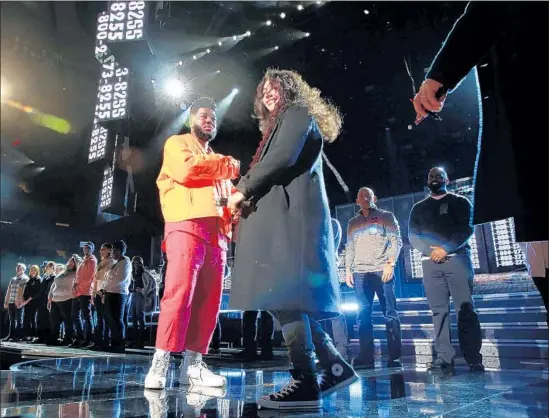  ?? Photograph­s by Carolyn Cole Los Angeles Times ?? KHALID and Alessia Cara await instructio­n while readying a performanc­e of Logic’s suicide prevention anthem “1-800-273-8255” for Sunday’s Grammys telecast.