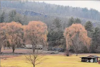  ?? ?? Coxsackie officials say the operators of this unlicensed tire dump in Coxsackie have defied orders to clear it out — and are actually adding to the pile.