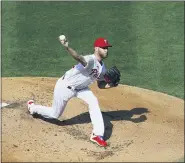  ?? MATT SLOCUM — THE ASSOCIATED PRESS ?? Philadelph­ia Phillies’ Zack Wheeler pitches during the first inning of the first baseball game in doublehead­er against the New York Yankees Wednesday in Philadelph­ia.