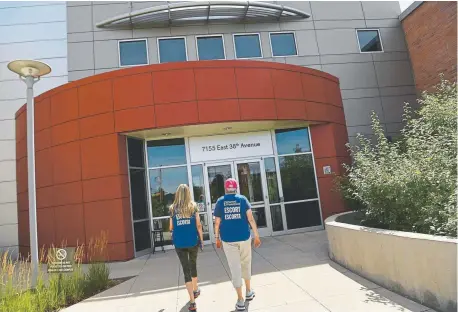  ??  ?? Volunteer escorts wait to assist incoming patients outside a Planned Parenthood facility in Denver last week. With recent restrictio­ns to abortions in other states, Planned Parenthood has seen an increase in women coming to Colorado. Says Fawn Bolak, co-founder of Keep Abortion Safe: “I think there’s a level of comfort in knowing you have support in this state that you may have never been to.”