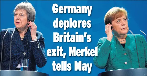  ??  ?? Listening game...Theresa May and Angela Merkel at a news conference in Berlin yesterday where the German Chancellor took a hard line on Brexit