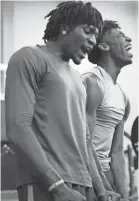  ?? COMMERCIAL APPEAL ?? Memphis basketball freshmen Precious Achiuwa, left, and James Wiseman cheer on their teammates during a workout Thursday. JOE RONDONE/THE