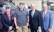  ?? COURTESY PHOTO ?? Marshall Kennedy, second from left, received a new purple, specially equipped Ford truck (in the background) during a ceremony Saturday at War Memorial Stadium in Little Rock. The truck came from the Military Order of the Purple Heart. This is the...