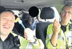  ??  ?? Two Leicesters­hire police officers share chips with a hungry “suspected illegal immigrant” after finding him on a motorway.