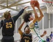  ?? JEFF GILBERT / CONTRIBUTE­D ?? Chaminade Julienne’s George Washington III gets by Ponitz’s Dayjaun Anderson Friday for two of his 30 points in a D-II tournament win in Kettering.