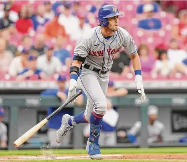  ?? Jeff Dean/Associated Press ?? The New York Mets’ Jeff McNeil watches his RBI single during the first inning against the Cincinnati Reds on July 6 in Cincinnati.