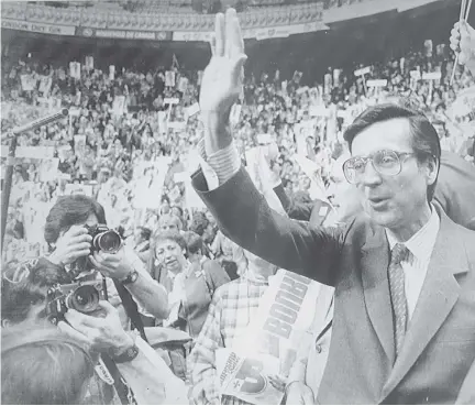  ??  ?? Robert Bourassa waves to supporters before his speech at the Quebec City convention that put him back at the reins of the Quebec Liberal Party. The Parti Québécois refused to back a motion marking the 30th anniversar­y of the Dec. 12, 1985 election of...