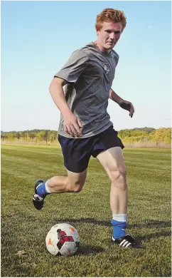  ?? STAFF PHOTO BY NANCY LANE ?? KICKIN’ IT: Concord-Carlisle’s Spencer Royal hits the field during a recent practice.