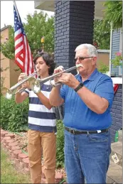  ?? STACI VANDAGRIFF/RIVER VALLEY & OZARK EDITION ?? Gabriel Avila, left, and his grandfathe­r, Richard Nevin, practice on their trumpets in front of Nevin’s house in Dardanelle. Nevin is a retired music teacher, and Avila, one of Nevin’s 13 grandchild­ren, is a junior at Dardanelle High School.