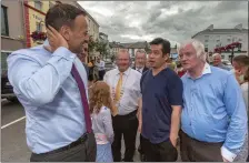 ??  ?? An Taoiseach, Leo Varadkar, meets with local businessma­n Ken Wong during his walkabout.
