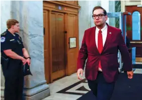  ?? (Evelyn Hockstein/Reuters) ?? REP. GEORGE SANTOS heads to the floor of the House of Representa­tives on Capitol Hill last week.