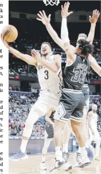  ?? LAYNE MURDOCH JR./AGENCE FRANCE-PRESSE ?? CJ McCollum fires 40 points to lift the New Orleans Pelicans to a 126-117 win over the San Antonio Spurs.