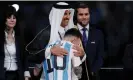  ?? The Guardian ?? Sheikh Tamim bin Hamad al-Thani, the Emir of Qatar, hugs Lionel Messi after the World Cup final. Photograph: Tom Jenkins/