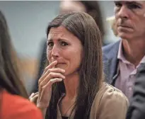  ?? PHOTOS BY THOMAS CORDY/PALM BEACH POST ?? Tracy Ferriter of Jupiter prepares to leave court without her husband, Timothy Ferriter, after he was found guilty in the aggravated child abuse jury trial against him at the Palm Beach County Courthouse in downtown West Palm Beach on Thursday.