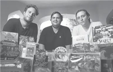  ?? CHRISTINA HOUSE/LOS ANGELES TIMES ?? Anthony Jimenez, from left, Michael Hotchkiss and Gio Mancuso, who run a live Instagram show selling and buying Pokémon collectibl­es, display their wares Aug. 6 in Los Angeles. The show has been clearing an average of $6,000 per event.