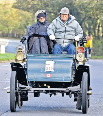  ??  ?? Billi and Ron Carey, who have a classic car collection worth £3.8 million, pictured during the 2013 London to Brighton rally