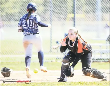  ?? Arnold Gold / Hearst Connecticu­t Media ?? Stamford catcher Amy Covino fields the throw at the plate as Julia SanGiovann­i of East Haven scores on Saturday.