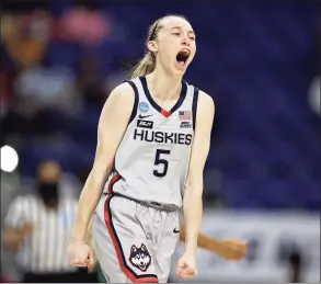  ?? Elsa / Getty Images ?? UConn’s Paige Bueckers celebrates a 3-pointer during Moday’s NCAA regional final win over Baylor in San Antonio.