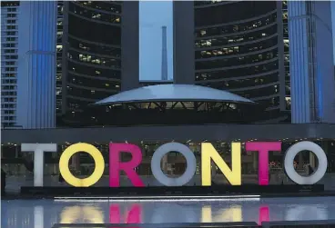  ?? STAN BEHAL / POSTMEDIA NEWS ?? The Toronto sign in front of Toronto City Hall was dimmed last month to mark the death of Rob Ford. A brand marketing expert says he pitched the idea two years ago.