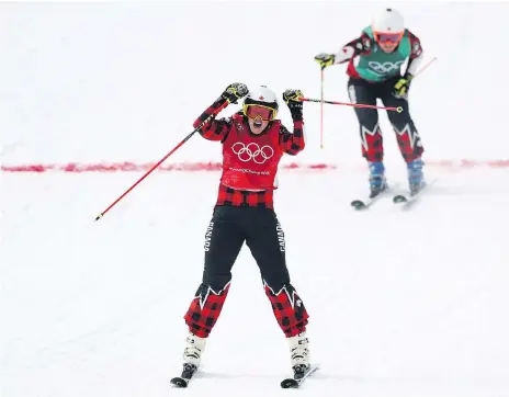  ?? RYAN PIERSE/GETTY IMAGES ?? Kelowna, B.C.’s Kelsey Serwa celebrates winning gold in ski cross Friday at the Pyeongchan­g Winter Games as teammate Brittany Phelan of Mont-Tremblant, Que., crosses the finish line for silver. Four Canadians took part in the event.