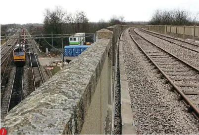  ??  ?? 1. A photo taken on the viaduct looking west on March 28, 2006, after new track had been laid to a runround loop at Swanbourne, just west of Bletchley, for ballast trains using Forders on the Bletchley to Bedford line. Heading north on the main line below is ‘Tug' No. 60099.