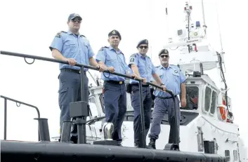  ?? HARLEY DAVIDSON/POSTMEDIA NEWS ?? From left, Captain Scott Parker, engineer Constantin Vasile, deckhands Brad Lavantis and Clint Thompson on the CCGS Cape Storm, a 47-foot search and rescue motor lifeboat.