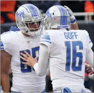  ?? CHARLES REX ARBOGAST — THE ASSOCIATED PRESS ?? Detroit Lions tight end Brock Wright, left, celebrates his two-yard touchdown reception with quarterbac­k Jared Goff during the Lions’ win over the Chicago Bears Sunday.