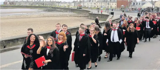  ??  ?? On the march Graduates parade along Troon Promenade 070717UWSG­rad_ 8