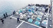  ?? PHOTOS BY JOE CAVARETTA/STAFF PHOTOGRAPH­ER ?? Coast Guard members prepare to offload 26 tons of cocaine Thursday from the flight deck of the cutter Hamilton at Port Everglades.