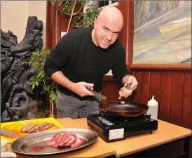  ??  ?? Mark Murphy of the Dingle Cookery School serving up samples of Dingle Salted Grass Beef at the Farmers’ Forum held in An Díseart on Friday night as part of the Food Festival.