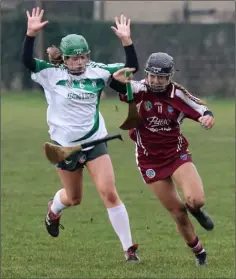  ??  ?? Ciara O’Connor of St. Martin’s drives past Cloughbawn’s Faye Codd.