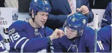  ?? TORONTO STAR FILE PHOTO ?? Leafs left wing Matt Martin (15) and Mitchell Marner sniff smelling salts before the game as the Leafs play the Flames last December 6.