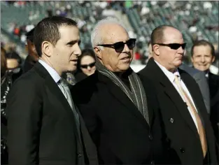  ?? ASSOCIATED PRESS FILE ?? The Eagles’ Howie Roseman, left, and Jeffrey Lurie, center, have taken their fair share of hits for the way the 2020season transpired.