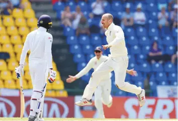  ?? AFP ?? England’s Jack Leach celebrates the dismissal of Sri Lanka’s Dhananjaya de Silva during the ■ fourth day of the second Test at the Pallekele Internatio­nal Stadium in Kandy yesterday.