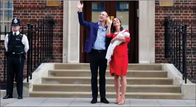  ?? The Associated Press ?? Britain’s Prince William and Kate, duchess of Cambridge stand with their newborn son outside the Lindo Wing at St Mary’s Hospital in Paddington, London, Monday.