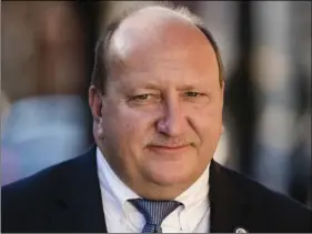  ??  ?? In a Nov. 28 file photo, Allentown Mayor Ed Pawlowski, who is facing corruption charges, walks to the federal courthouse in Philadelph­ia during a break in a pretrial hearing. AP PHOTO/MATT ROURKE