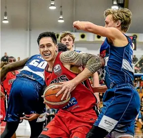  ?? JOHN DAVIDSON/PHOTOSPORT ?? The path of Rams captain Tony Tolovae is blocked Nelson’s Australian import Kyle Adnam during the national basketball league match, won by the Giants, in Christchur­ch on Saturday night.