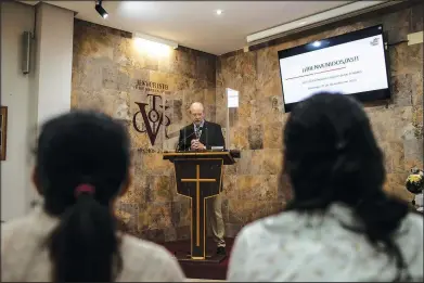  ?? (AP/Manu Brabo) ?? Kent Albright, a Baptist pastor from the United States, conducts Sunday service on Dec. 5 at his evangelica­l church in Santa Marta de Tormes on the outskirts of Salamanca, Spain.