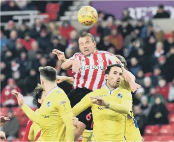  ??  ?? Lee Cattermole wins a high ball at the Stadium of Light. Pictures by Frank Reid.