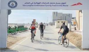  ?? ?? ↑
A marble plaque engraved with the Guinness World Records logo is seen installed at the starting point of the Al Qudra Cycling Track.