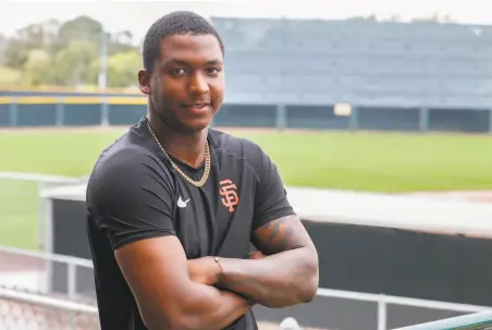  ?? Darryl Webb / Special to The Chronicle ?? Giants shortstop prospect Marco Luciano poses outside the team’s training facilities in Scottsdale, Ariz., in March.