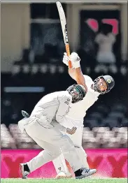  ??  ?? Rishabh Pant launches into one from Nathan Lyon.