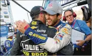  ?? BRIAN LAWDERMILK / GETTY IMAGES ?? Chase Elliott (right) is congratula­ted by Jimmie Johnson after winning the Monster Energy NASCAR Cup Series race at Dover on Oct. 7.