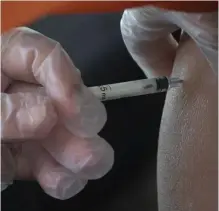  ?? Getty iMaGes FiLe ?? NOT VERY EFFECTIVE: A woman is inoculated with the CoronaVac vaccine, developed by China’s Sinovac laboratory to ward against COVID-19, at a vaccinatio­n center at Carrasco airport in Uruguay on April 8.