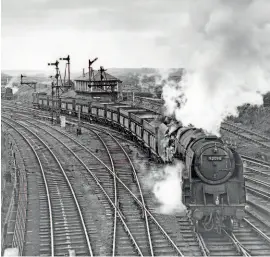  ?? MORTONS RAILWAY MAGAZINE ARCHIVE/M. DUNNETT. ?? Right: Behind 9F 2-10-0 No. 92098, pictured at South Pelaw Junction with an iron ore train from Tyne Dock on January 24, 1964, is another 9F that will bank the train up the steep gradient to Consett. What an impressive sight that must have made!