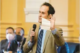 ?? STEVE HELBER/AP ?? Del. Schuyler VanValkenb­urg, D-Henrico, gestures during a speech on the floor of the Virginia House of Delegates at the Capitol in Richmond on Jan. 17, 2022.